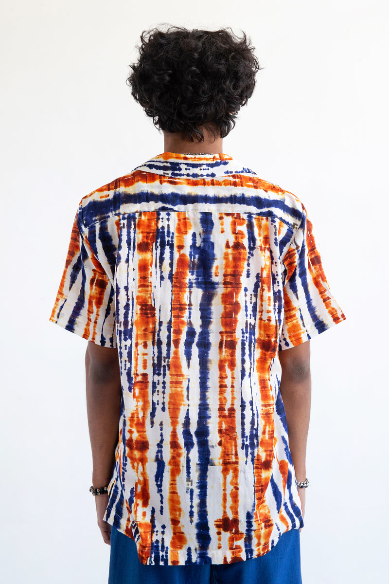 back view of orange and blue batik printed short sleeve camp collar shirt