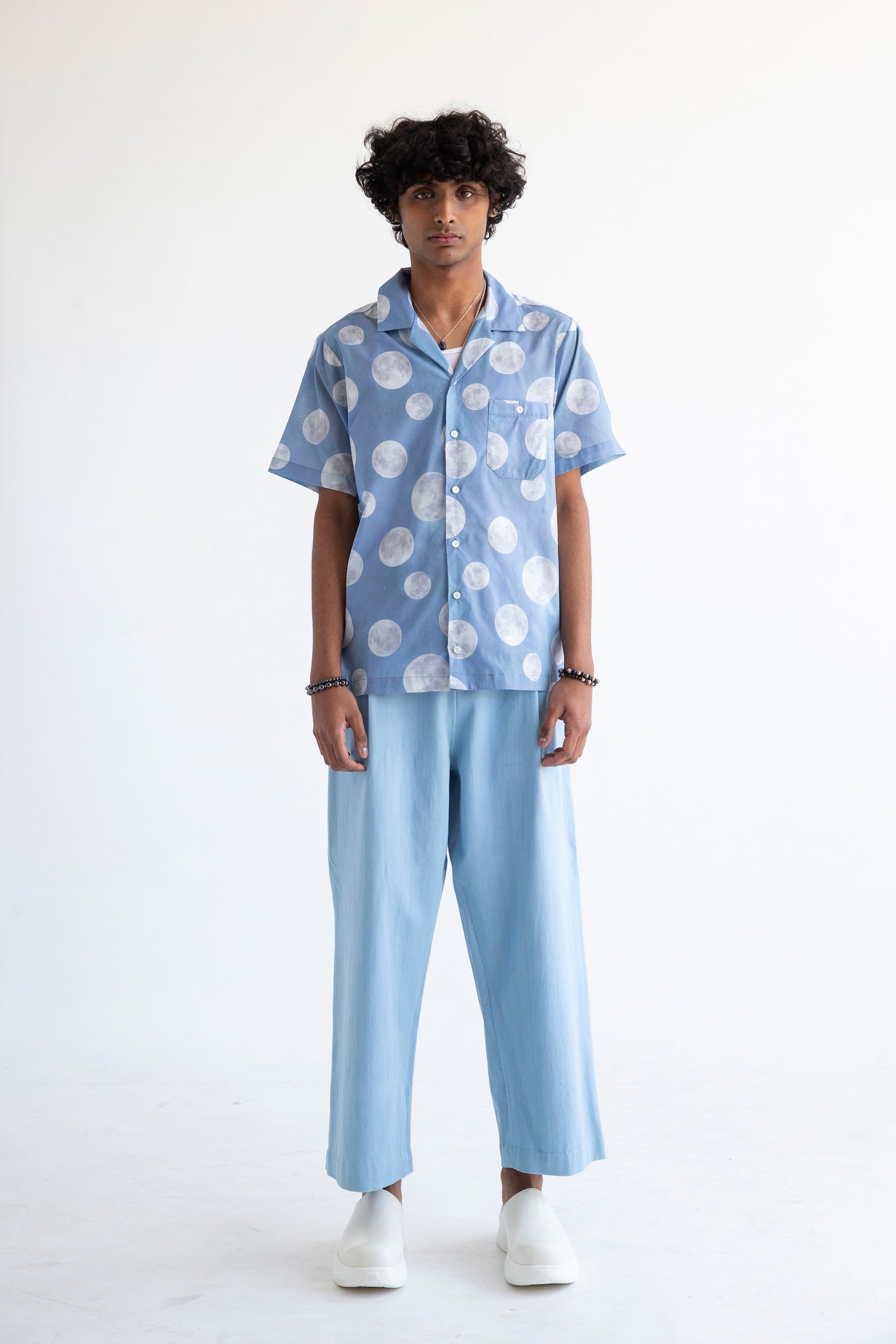 casual mens outfit with resort shirt and light blue pants
