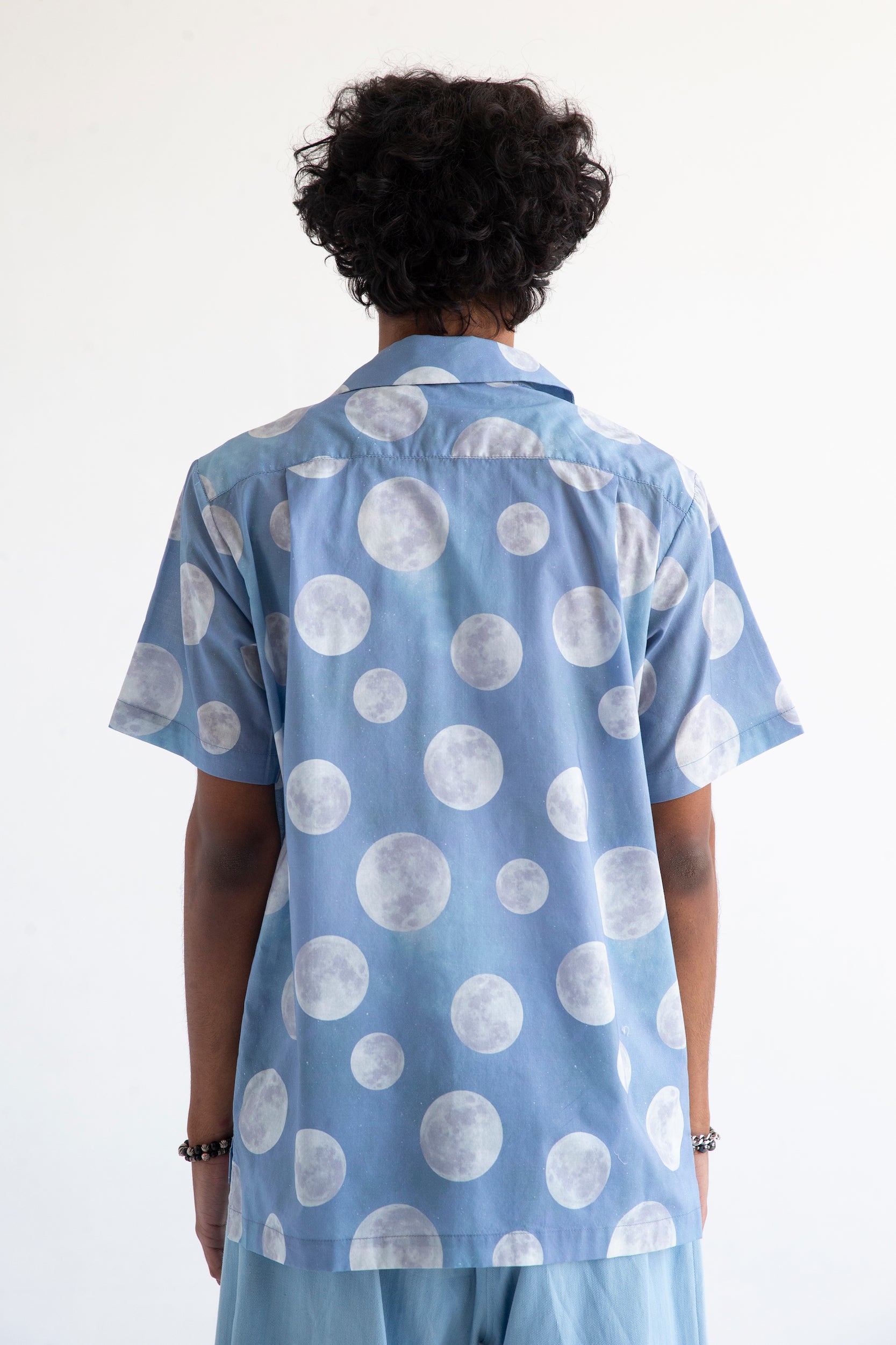 back view of light blue casual shirt with moon print